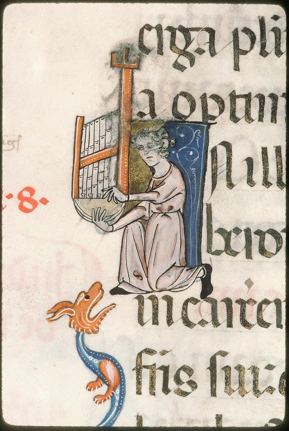 A Musician Playing a Portative Organ