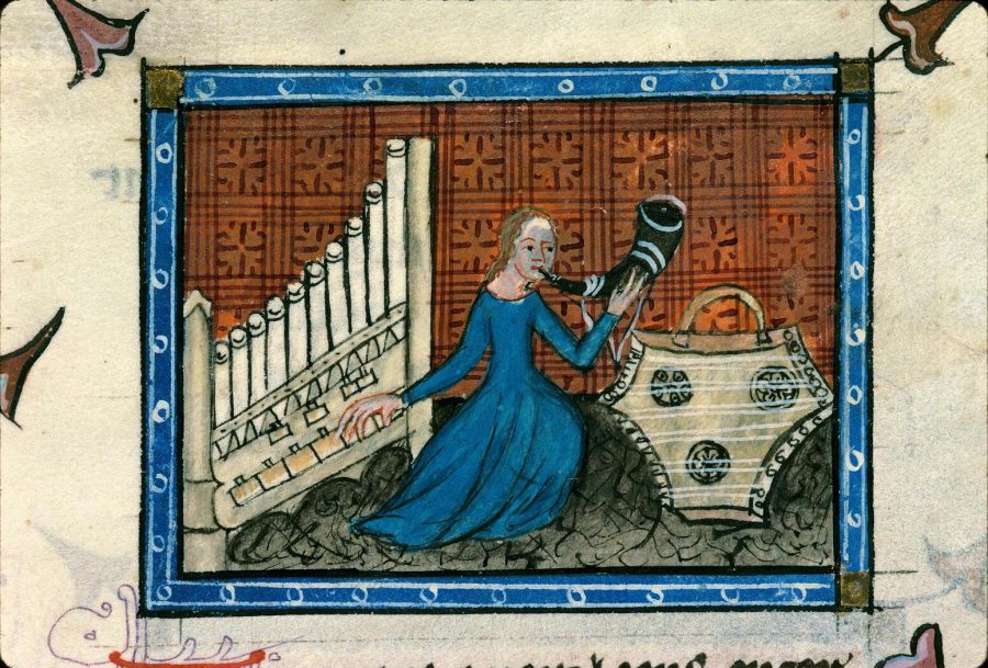 Latrie playing the organ and the horn