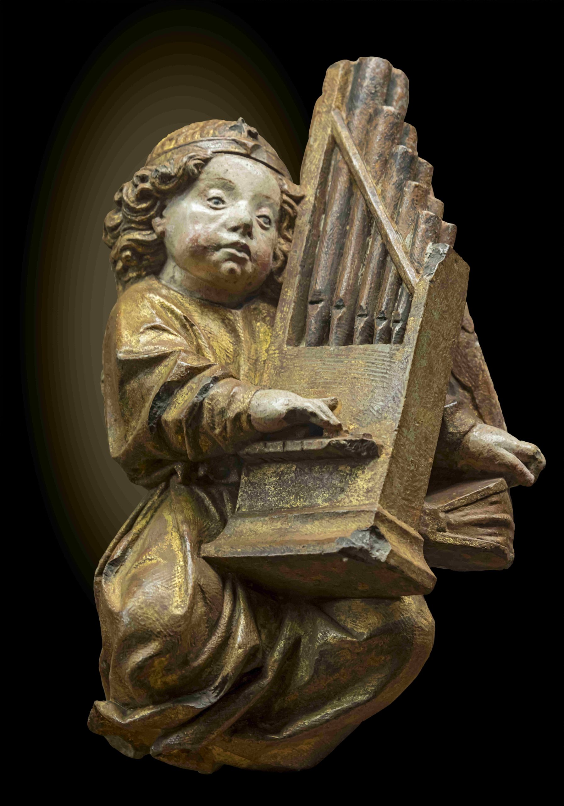 Polychrome statuette of an angel playing the organ